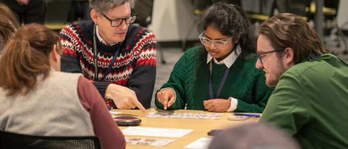 2025 MTech Connect-article-15 Attendees playing cards at the 2025 MTech Connect Symposium