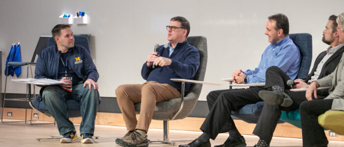 2025 MTech Connect-article-21 From left to right: Kenny Moore, Ted Hanss, Dan Maletta, Scott Arnst, and Kerry Flynn speaking at the MTech Connect Leadership Panel