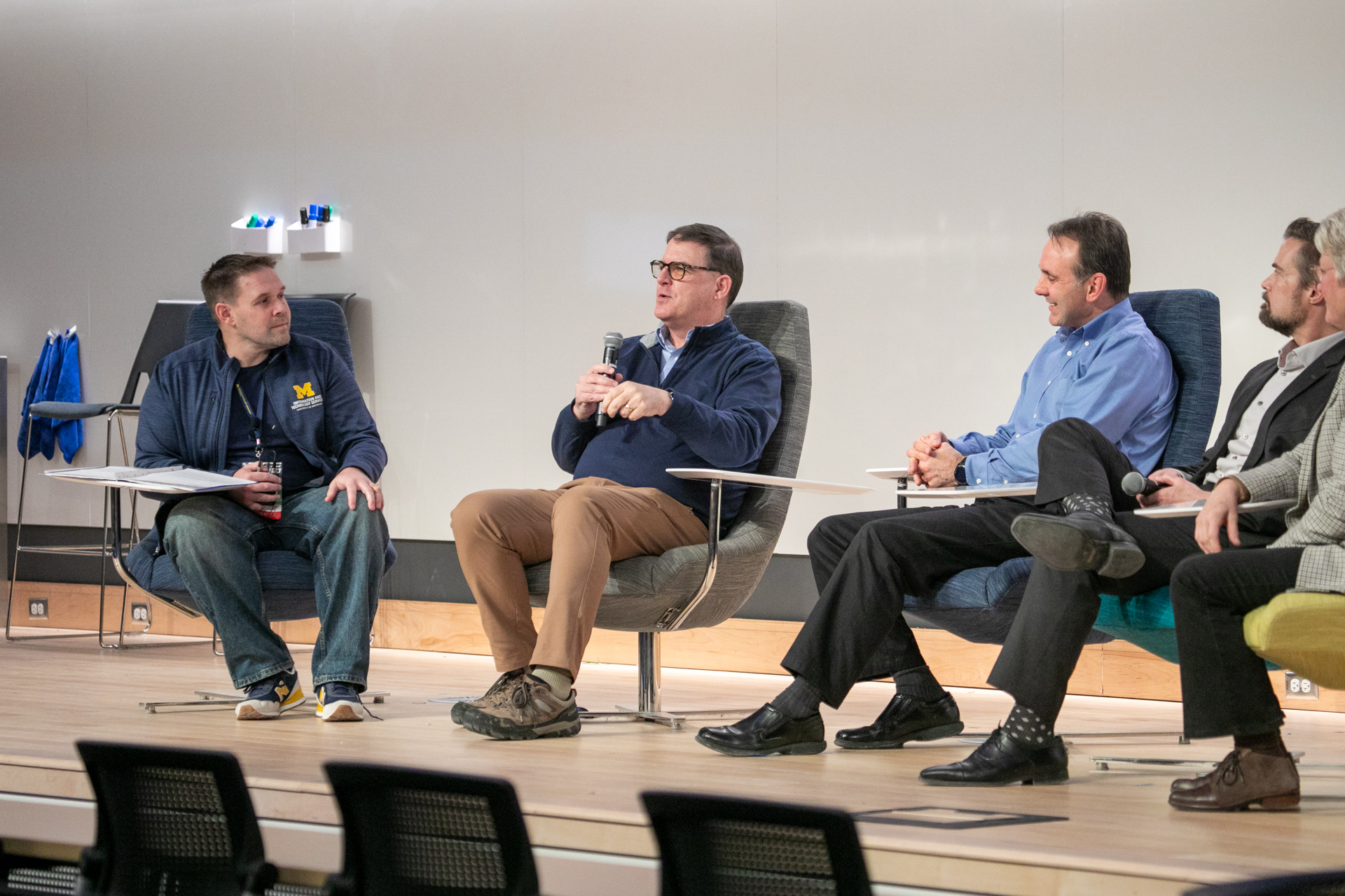From left to right: Kenny Moore, Ted Hanss, Dan Maletta, Scott Arnst, and Kerry Flynn speaking at the MTech Connect Leadership Panel