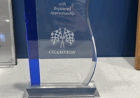 Race to Talent Champion award sitting on a desk.