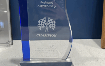 Race to Talent Champion award sitting on a desk.