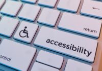 A keyboard with the shift key re-labeled to accessibility and a person-in-wheelchair icon to the left of it