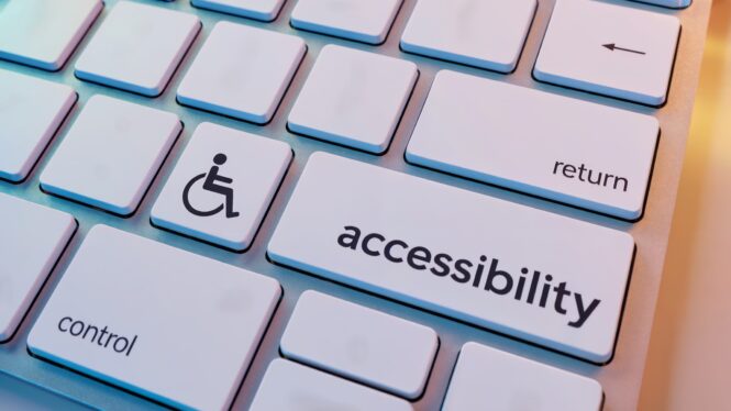 A keyboard with the shift key re-labeled to accessibility and a person-in-wheelchair icon to the left of it