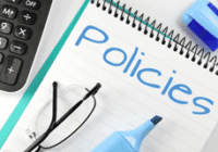 Image of a notepad with the word policy written on it.