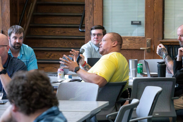 During the tabletop exercise, attendees practiced identifying, documenting, and resolving a technology disruption.